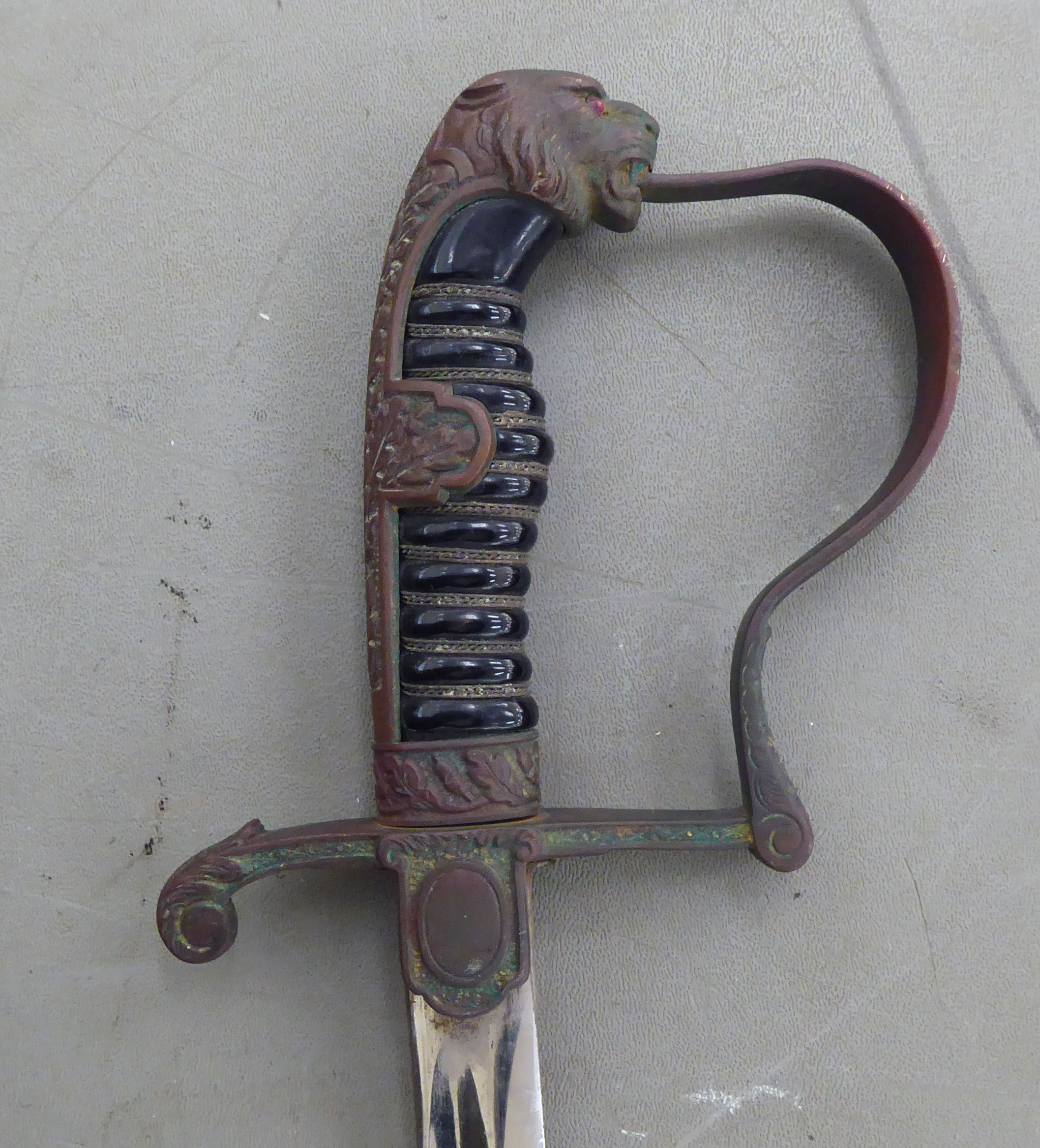 A Nazi military issue sword with a moulded handgrip, lion's head pommel and an acorn and oakleaf - Image 4 of 5