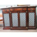 A 20thC Regency inspired crossbanded rosewood and flame mahogany finished breakfront sideboard,