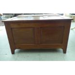 A modern panelled hardwood chest with a hinged lid  19"h  31"w