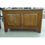 A mid 20thC tri-panelled honey coloured oak chest with a hinged lid  19"h  31"w