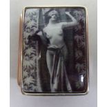 A silver pill box, the lid decorated with Art Deco inspired erotica  stamped Sterling