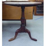 A George III mahogany tip-top pedestal table, raised on a tripod base  28"h  26"dia