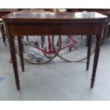 A Regency mahogany tea table with a foldover top, raised on spiral turned legs  30"h  36"w