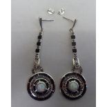 A pair of Art Deco inspired silver disc design pendant earrings, sets with opals and marcasite
