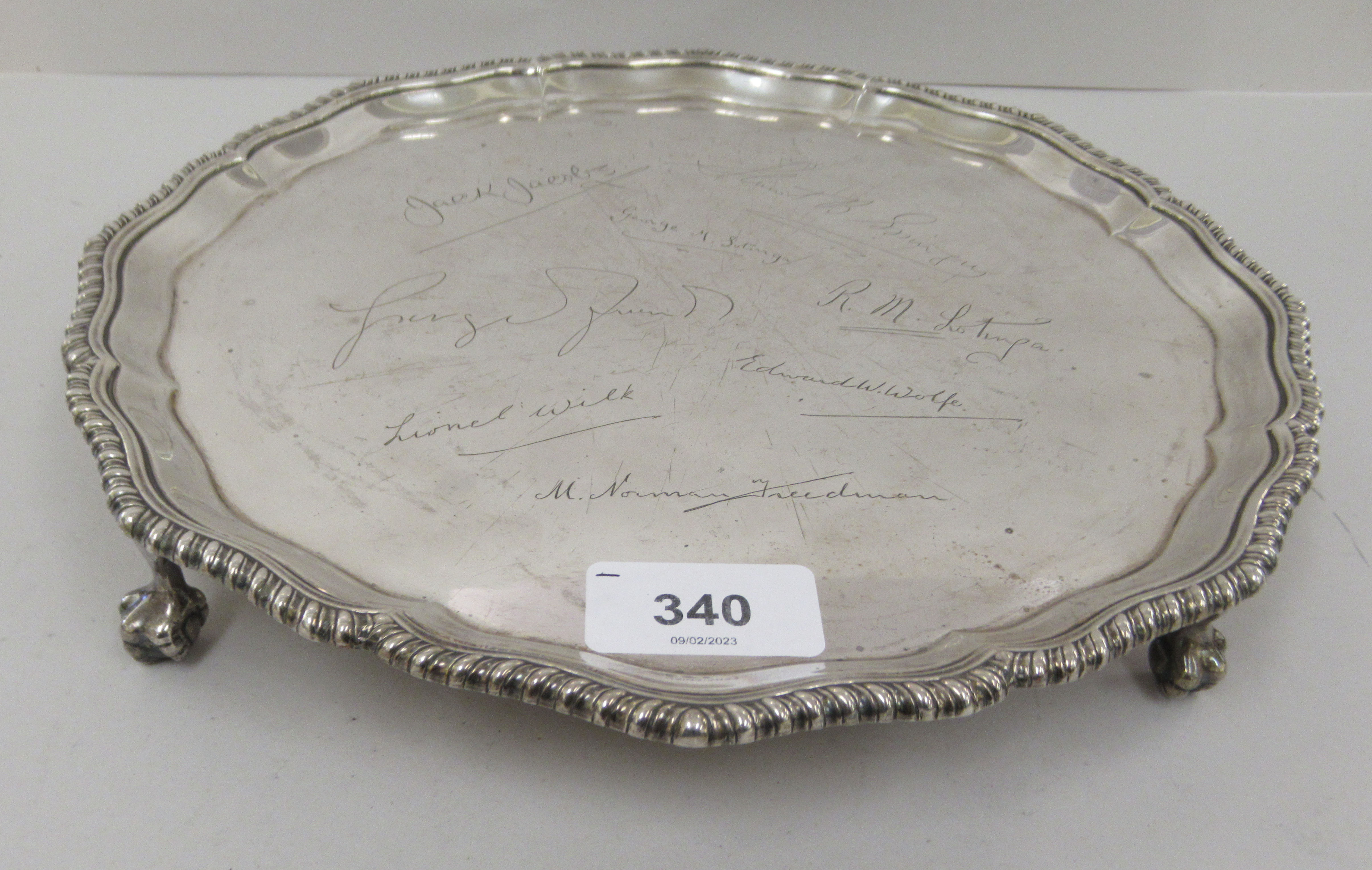 A Georgian style silver salver with a raised piecrust and gadrooned border, elevated on talon and - Image 2 of 7