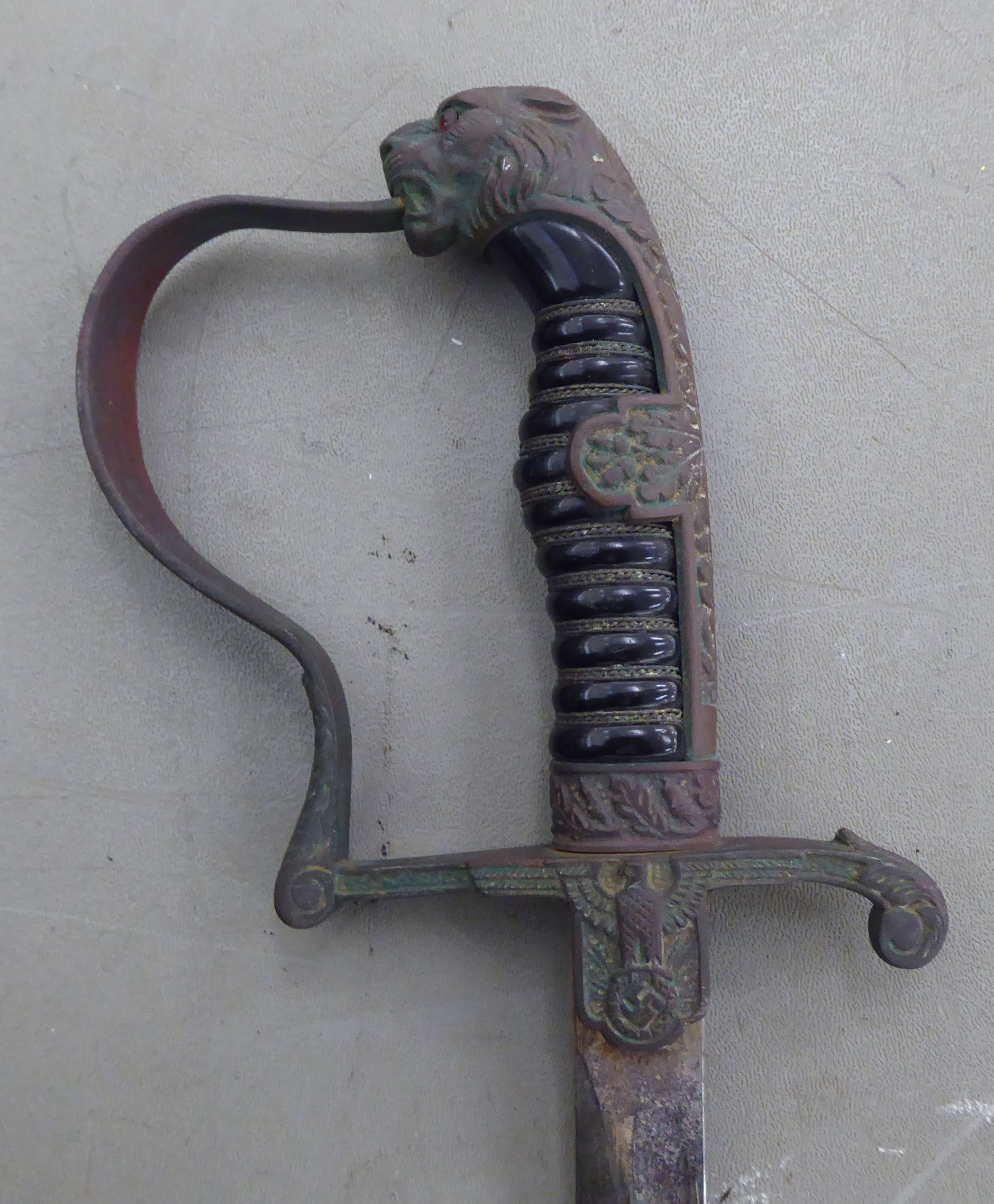 A Nazi military issue sword with a moulded handgrip, lion's head pommel and an acorn and oakleaf - Image 3 of 5