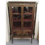 A 20thC reproduction of an 18thC Continental mahogany vitrine with pictorial panels and a pair of