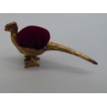 A miniature novelty brass pin cushion, fashioned as a pheasant