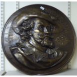 A Belgian made, antique finished brass plaque, inscribed 'Petrvs Pavlvs Rvbens' depicting a head and