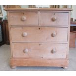 An early 20thC pine, four drawer dressing chest, on a plinth and bun feet  35"h  36"w