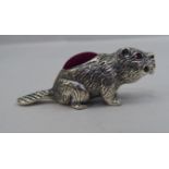 A novelty silver pin cushion, fashioned as a beaver with ruby coloured eyes  stamped 925