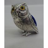 A miniature silver novelty pin cushion, fashioned as an owl  stamped Sterling