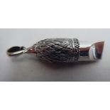 A silver whistle, fashioned as a bird of prey, on a pendant ring  stamped 925