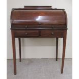 An Edwardian lady's satinwood inlaid mahogany cylinder front desk with a fitted interior, over two