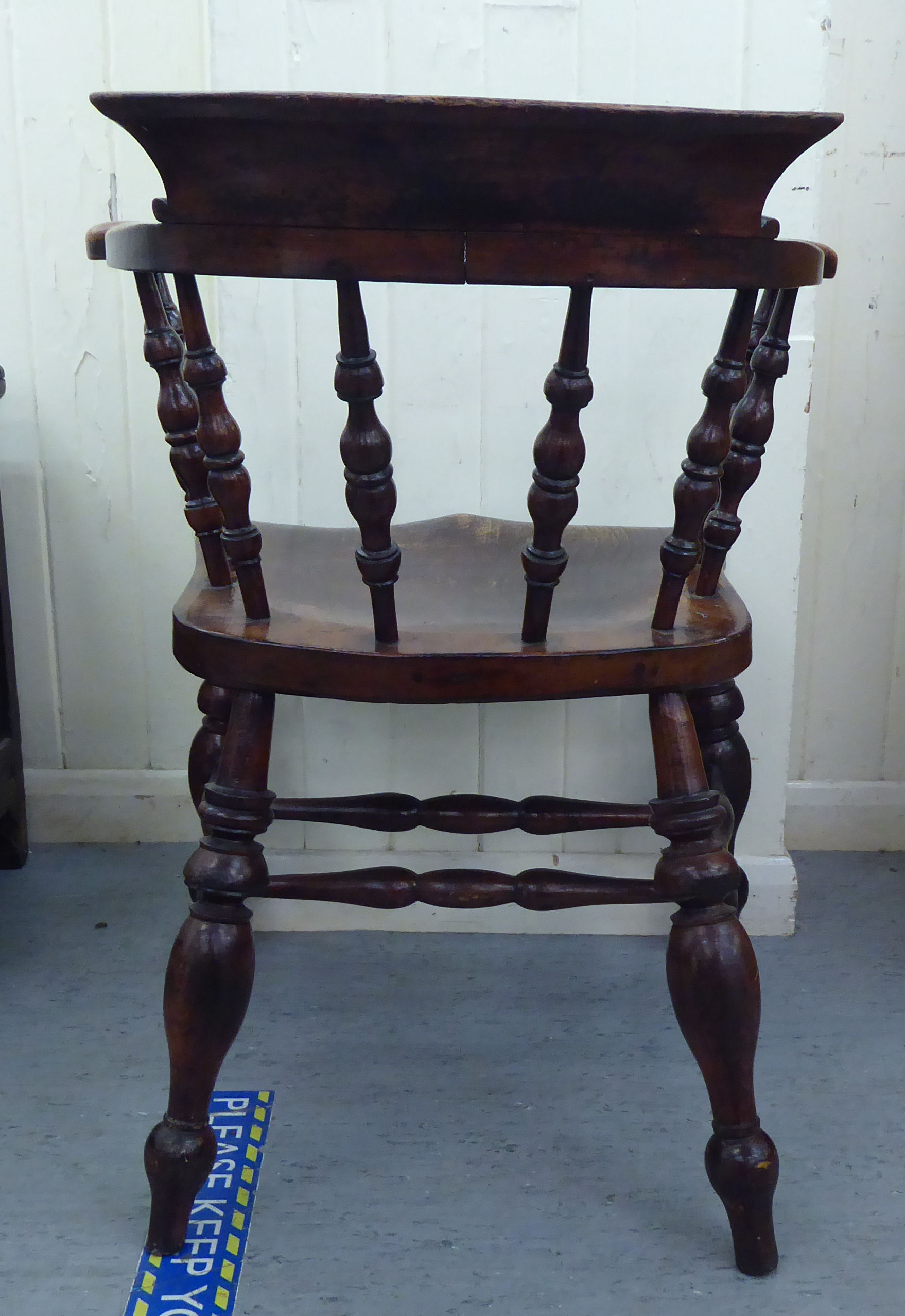 A late 19thC stained beech and elm framed Captains chair, the round back with scrolled level arms, - Image 3 of 4