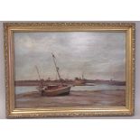 WB Rowe - an estuary scene with a man leaning into a beached sailing boat  oil on board  bears a