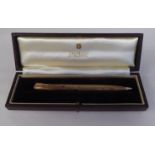 A Parker 9ct gold cased propelling pencil with engine turned decoration  cased