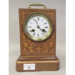 An early 20thC carriage style mantel clock, in a satin mahogany string inlaid and marquetry case