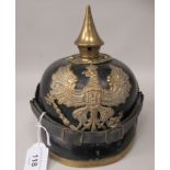 A German World War I brass mounted pickelhaube with a helmet plate and chin strap  (Please Note: