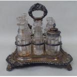 An early 20thC silver plated condiments carrier of incurved square form with foliate, shell and