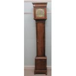 An 18thC oak longcase clock, the square hood with a window and flank pillars, over a pendulum