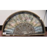 A 19thC fan with decoratively pierced and gilded mother-of-pearl sticks and guards, the paper