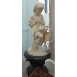 Ugo Zannoni - a 19thC Italian carved marble figure, a girl seated on a stool, reading a book,