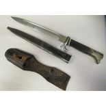 A 1930s German military bayonet with a rivetted two-part handgrip  stamped 41 on the guard, the