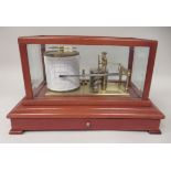 A 1980s Rapport of London lacquered brass barograph, in a fully bevel glazed mahogany case,