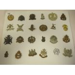 Approx. twenty-four military regimental cap badges and other insignia, some copies: to include The