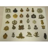 Approx. thirty military regimental cap badges and other insignia, some copies: to include RNAS;