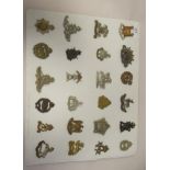 Approx. twenty-four military regimental cap badges and other insignia, some copies: to include Royal