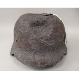 A replica German World War II steel helmet shell with SS decals