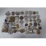 Over forty miscellaneous Scottish military regimental cap badges and other insignia, some copies: to