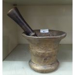 A cast bronze pestle and mortar, the mortar with collared sides  6"h