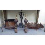 Hearth related items: to include a late Victorian cast iron fire basket; and a matching pair of