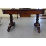 A William IV rosewood centre table with two frieze drawers, raised on opposing fluted pillar