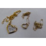 A Carissima 9ct gold heart shaped pendant, on a fine neckchain  boxed; and another, similar in 9ct