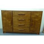 A modern North American hardwood sideboard, comprising four central drawers, flanked by a pair of