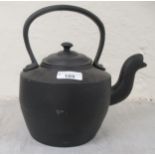 A black cast iron kettle