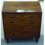 An early 19thC mahogany bureau with a fall front, over four long drawers, raised on turned legs