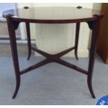 A modern reproduction of a 19thC string inlaid mahogany occasional table, raised on square,