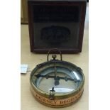 A reproduction of a circa 1906, brass cased and glazed compass  boxed