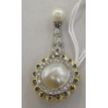 An 18ct gold pearl, diamond and sapphire set pendant brooch