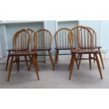 A set of six Ercol stained beech and elm framed, low hoop and stickback dining chairs, the solid