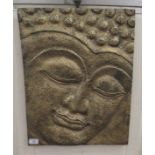 A modern gilt sprayed and moulded composition plaque, the face of a Buddha  17.5" x 23"