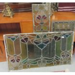 Three early 20thC coloured lead glass panels  largest 24" x 41"