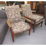 A pair of modern Parker Knoll high backed, beech framed, open armchairs with cushioned floral fabric