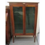 An Edwardian mahogany display cabinet, raised on square, tapered legs  51"h  32"w