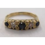 An 18ct gold diamond and sapphire ring